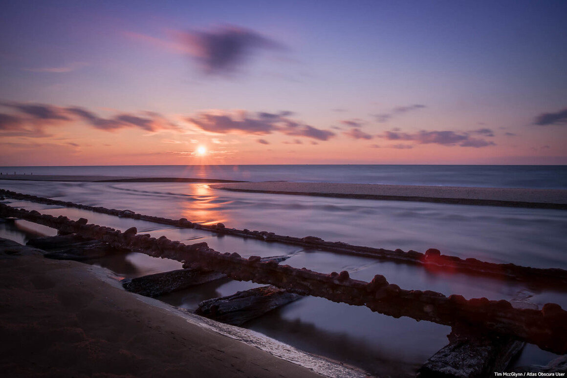 The "Sometimes" train tracks occasionally emerge during low tide.